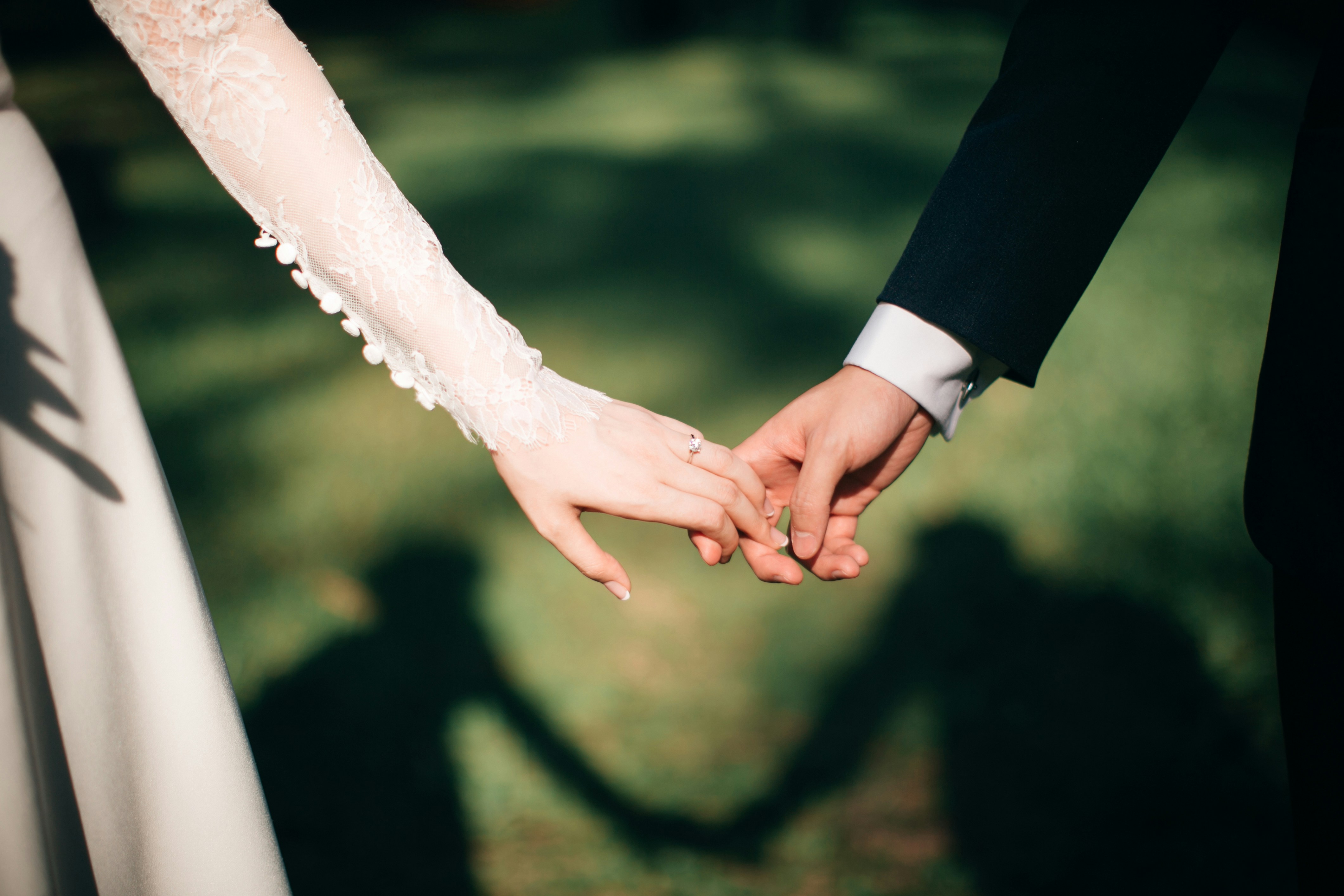 Couples hands with wedding rings